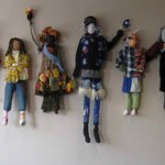Wall installation of figures created with Amy Rich by students at Mercy Montessori students grades 4-8